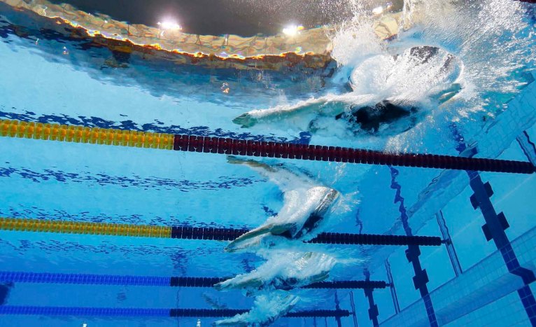 (From top to bottom) Missy Franklin of the U.S., Italy's Federica Pellegrini, Canada's Barbara Jardin and Canada's Samantha Cheverton swim during the women's 200m freestyle heats at the London 2012 Olympic Games at the Aquatics Centre July 30, 2012. REUTERS/Michael Dalder (BRITAIN - Tags: SPORT SWIMMING OLYMPICS) ORG XMIT: OLYCN01